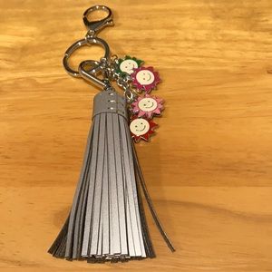 Keychain with reflective tassel and sun charms